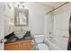 Stylish bathroom featuring unique bowl sink, decorative mirror, and a shower-tub combination at 12947 Dunand Blvd, Hampton, GA 30228