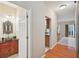 Charming bathroom featuring an ornate mirror and a stone vessel sink on a red vanity at 12947 Dunand Blvd, Hampton, GA 30228