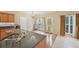 Stylish kitchen featuring granite countertops, wood cabinets and stainless steel appliances at 12947 Dunand Blvd, Hampton, GA 30228