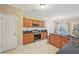 Open concept kitchen featuring stainless steel appliances, granite countertops, and a breakfast nook at 12947 Dunand Blvd, Hampton, GA 30228