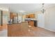 Bright kitchen area with granite countertops, wood cabinets, and stainless steel appliances at 12947 Dunand Blvd, Hampton, GA 30228