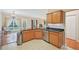 View of a kitchen with granite countertops, stainless steel dishwasher, and breakfast nook at 12947 Dunand Blvd, Hampton, GA 30228