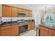 Spacious kitchen featuring stainless steel appliances, generous counter space, and a charming breakfast nook at 12947 Dunand Blvd, Hampton, GA 30228