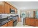 Well-equipped kitchen featuring stainless steel appliances, ample counter space, and a breakfast nook at 12947 Dunand Blvd, Hampton, GA 30228