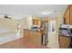 Open kitchen featuring a central island with dark countertops and stainless steel appliances at 12947 Dunand Blvd, Hampton, GA 30228