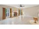Spacious living room with tile flooring, a cozy fireplace, and large windows at 12947 Dunand Blvd, Hampton, GA 30228