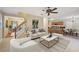 Staged living room flows into the kitchen and dining area creating an open and airy feel at 12947 Dunand Blvd, Hampton, GA 30228