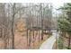 Aerial view of the home featuring mature trees and a long driveway at 2796 County Line Nw Rd, Acworth, GA 30101