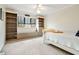 Bright bedroom with built-in bookshelves and a cozy window seat at 2796 County Line Nw Rd, Acworth, GA 30101