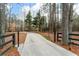 Driveway entrance with black gates framed by beautiful trees at 2796 Private Drive at 2796 County Line Nw Rd, Acworth, GA 30101