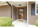 A close up of the front door of a home with neutral siding and a small porch at 2796 County Line Nw Rd, Acworth, GA 30101