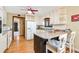 Cozy kitchen features white cabinets, a breakfast bar, and stainless steel appliances at 2796 County Line Nw Rd, Acworth, GA 30101