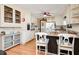 Bright kitchen features white cabinetry, a breakfast bar, and hardwood flooring at 2796 County Line Nw Rd, Acworth, GA 30101
