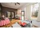 Relaxing porch with wood flooring, an outdoor dining area, and large windows at 2796 County Line Nw Rd, Acworth, GA 30101
