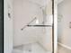 Modern shower with subway tile, dark hardware, and a glass door at 2796 County Line Nw Rd, Acworth, GA 30101