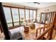 Bright sunroom featuring large windows, a cozy seating area, and a unique brick floor at 2796 County Line Nw Rd, Acworth, GA 30101