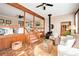 Inviting sunroom with wood accents, a rustic wood-burning stove, and comfortable furnishings at 2796 County Line Nw Rd, Acworth, GA 30101