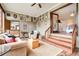 Open sunroom with a seating area and staircase that leads to another part of the house at 2796 County Line Nw Rd, Acworth, GA 30101