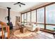 Bright and airy sunroom boasting large windows, a charming seating area, and wood-burning stove at 2796 County Line Nw Rd, Acworth, GA 30101