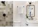Bathroom with tiled shower, modern fixtures, and a vanity with a white countertop at 2818 Thornbriar Rd, Atlanta, GA 30340