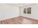 Bedroom with hardwood floors, window, and white walls at 2818 Thornbriar Rd, Atlanta, GA 30340