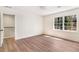 Large bedroom with connecting rooms, light hardwood floors and white paint at 2818 Thornbriar Rd, Atlanta, GA 30340