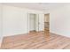 Large bedroom with closet, light hardwood floors and white paint at 2818 Thornbriar Rd, Atlanta, GA 30340
