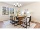 Dining room with hardwood floors, modern chandelier, and ample natural light at 2818 Thornbriar Rd, Atlanta, GA 30340