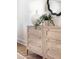Stylish bedroom dresser with decorative lamp, houseplant, and wavy mirror detail at 2818 Thornbriar Rd, Atlanta, GA 30340