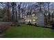 An alternate angle view of the charming white two-story home with green lawn at 2818 Thornbriar Rd, Atlanta, GA 30340