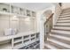 Foyer featuring built-in storage, slate tile, and hardwood stairs at 2818 Thornbriar Rd, Atlanta, GA 30340