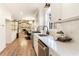 Modern kitchen showcasing white cabinets, quartz countertops, stainless steel appliances, and open layout at 2818 Thornbriar Rd, Atlanta, GA 30340