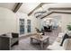 Open living room showcasing vaulted ceiling, hardwood floors, and access to balcony at 2818 Thornbriar Rd, Atlanta, GA 30340