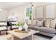 Cozy living room featuring a neutral color palette, stylish decor, and a view to the outside at 2818 Thornbriar Rd, Atlanta, GA 30340