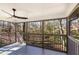 Screened porch boasts wooded views and a ceiling fan at 2818 Thornbriar Rd, Atlanta, GA 30340