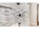 Tiled shower with built-in niche and matte black shower head at 2818 Thornbriar Rd, Atlanta, GA 30340