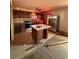 Kitchen features stainless steel appliances, an island, and ample cabinet space for storage and meal prep at 633 Langston Sw Dr, Atlanta, GA 30315