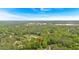 An aerial view of a property marker surrounded by lush green trees in a residential area at 8980 Country Club Dr, Douglasville, GA 30134