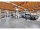 Unfinished basement featuring a wooden ceiling, gray painted floors and utilities at 8980 Country Club Dr, Douglasville, GA 30134