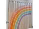 Shower boasting a colorful rainbow-themed curtain, infusing a playful vibe to the space at 8980 Country Club Dr, Douglasville, GA 30134