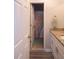 Bathroom featuring a shower with a rainbow curtain, granite countertop, and wood-look floors at 8980 Country Club Dr, Douglasville, GA 30134