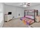 bedroom with a bunk bed, dresser, carpeted floors, and a comfortable vibe at 8980 Country Club Dr, Douglasville, GA 30134