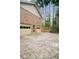 Multi-car garage exterior showcasing doors, driveway, and brick facade at 8980 Country Club Dr, Douglasville, GA 30134