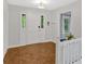 Bright foyer with hardwood floors and coat closet at 8980 Country Club Dr, Douglasville, GA 30134
