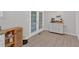 Eat-in kitchen area with French doors and a charming cabinet perfect for storage or a coffee bar at 8980 Country Club Dr, Douglasville, GA 30134