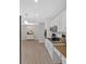 Well-appointed kitchen with white cabinetry, granite countertops, stainless steel appliances, and modern lighting at 8980 Country Club Dr, Douglasville, GA 30134