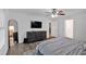 Spacious main bedroom featuring hardwood floors, an entertainment center, and abundant natural light at 8980 Country Club Dr, Douglasville, GA 30134