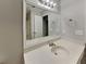 Bathroom vanity with large mirror, modern lighting and neutral colors at 250 Whisperwood Nw Ln, Marietta, GA 30064