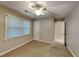 Bright bedroom features neutral paint, ceiling fan, and a window letting in plenty of natural light at 250 Whisperwood Nw Ln, Marietta, GA 30064