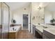 Bathroom with soaking tub, double sinks and tile flooring at 2782 Blue Moon Dr, Buford, GA 30519